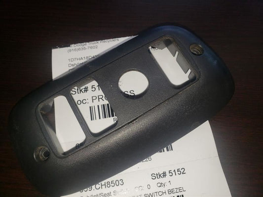 2003 DODGE RAM1500 DRIVER SIDE POWER SEAT SWITCH BEZEL. PART NUMBER 836473AE