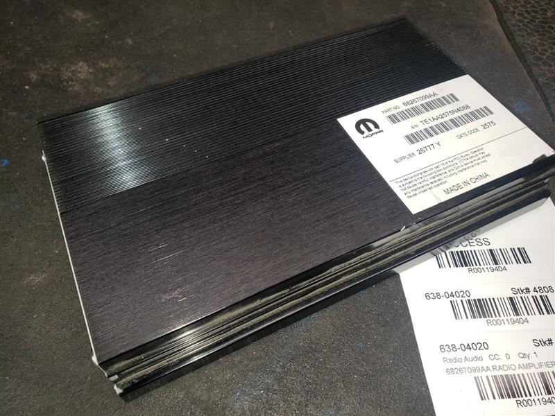 2016 RAM1500 RADIO AMPLIFIER. PART NUMBER 68267099AA