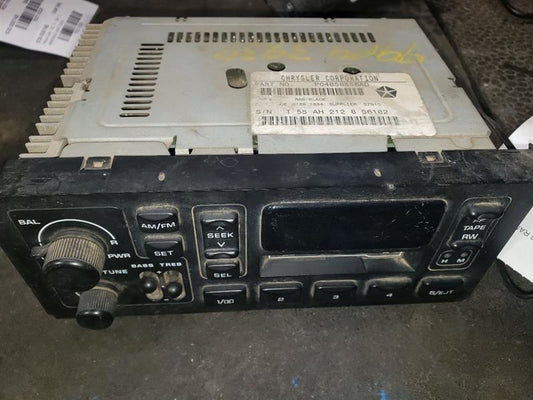 1999 DODGE RAM1500 AM/FM CASSETTE RADIO. PART NUMBER 04858556AD